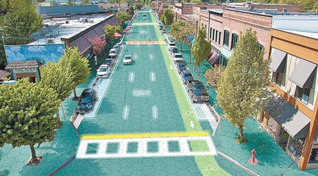 太陽能馬路完成鋪設的構想圖，可見路面的交通標誌及指示皆由LED燈泡顯示。（互聯網圖片）