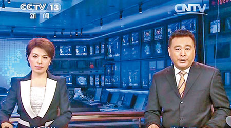 張宏民（右）與李瑞英將離開央視《新聞聯播》節目。（中新社圖片）