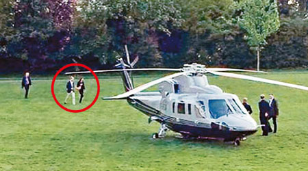 威廉夫婦（紅圈示）被拍下準備乘直升機返回大宅。（互聯網圖片）