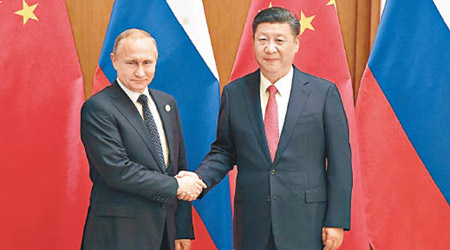 習近平（右）與普京會晤時指，中俄是好鄰居、好朋友、好夥伴。