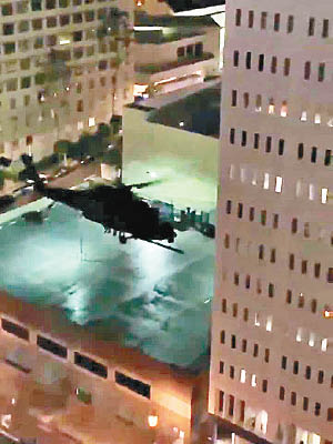 美軍直升機在洛杉磯鬧市低空飛行。（互聯網圖片）