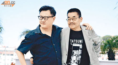 邱金海導演（左）和漫畫家辰巳嘉裕一同出席康城電影節。