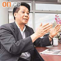 百齡主席黃錦亮相信公司明年可以扭虧為盈。	（資料圖片）