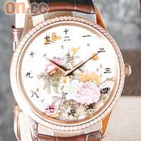 (a) 腕錶取材自居廉大師描繪花卉和蝴蝶的作品。限量發售25套的Master Ultra Thin錶殼為18K玫瑰金，並鑲嵌80顆閃爍奪目的鑽石，配以高貴的鱷魚皮帶。$403,000