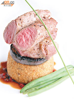 Lamb Fillet on a Haggis Potato Cake with Smoked Paprika Eggplantand Pink Peppercorn Red Wine Sauce