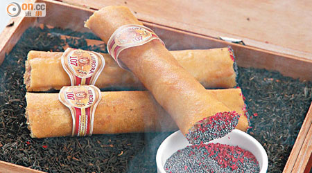 Duck Cigar Havana Style  $75<br>鴨肉低溫慢煮，拆肉包成春卷再炸，為增加趣味性更製成雪茄造型，以罌粟籽等扮煙灰，配雪茄盒，非常像真。