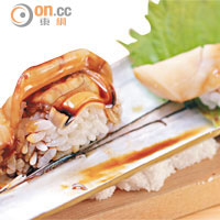 蟶子壽司 $80/件<br>罕有的壽司配搭，爽口彈牙的九州蟶子塗上鰻魚汁，配以北海道七星米製成的壽司飯，煙韌中帶適當黏度，成為手握壽司的亮點。