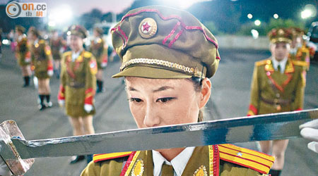 《Ri Hyang Yon, dancer, during a practice session for the Arirang Games in the car park of the May Day Stadium》