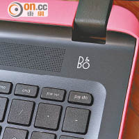 鍵盤區以漸變黑色設計，上方喇叭位旁可見B&O字樣。