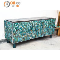 Enfilade Cabinet in Turquoise<br>櫃門用上大小不一的凸面綠松石裝嵌，配上綠銹化（Patinate）的黃銅櫃腳，別具質感。