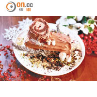 朱古力栗子聖誕樹頭蛋糕<br>充滿節日氣氛的傳統聖誕蛋糕，以混有橙味果醬的榛子醬和朱古力海綿蛋糕製作而成，精緻美觀，搶眼吸睛。