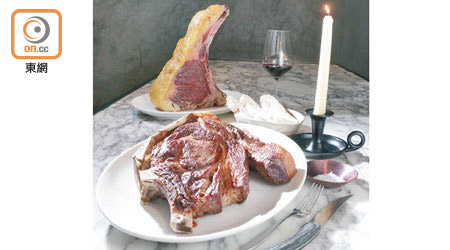 （前）45 Days Dry Aged 12 to 18 Years Old Pasture Raised Rubia Gallega $2,990、（後）Galician Smoked Beef Fat Candles with Ciabatta $135<br>來自西班牙加西利亞的連骨肉眼扒重達2.2kg，選用300℃高溫的陶板燒烤，受熱均勻，肉質煙韌。將原隻牛切下的脂肪融掉製成蠟燭，點着放餐桌上情調浪漫，又可蘸麵包吃，牛香馥郁。