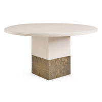 Solid Dining Table<br>飾有木皮的實木桌面，配上線條優美的液態金屬枱腳，不論從甚麼角度看，它都是一款美麗的餐桌。