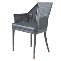 Cane Armchair<br>採用藤條製成的扶手椅，棱角分明的幾何形狀和輪廓，令整張椅充滿現代感。