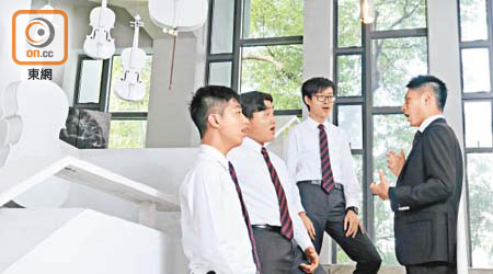 得獎學生（左起）劉永康、李梓睿及鄭懷恩認為音樂文化已滲透校園，而良好的氛圍有助培養音樂造詣。