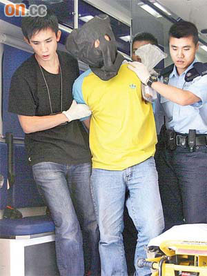 疑兇李忠民在案發後遭警員拘捕帶署調查。	（資料圖片）