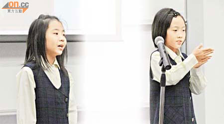 陳紀尤（右）與同學鄧絲蔓（左）在共融班內透過手語及口語兩種媒介，溝通障礙減少。	（蘇文傑攝）