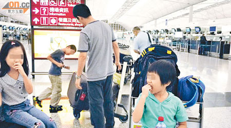 深圳有公司員工及家屬到新西蘭免費旅行，一行人因颱風滯留港機場兩句鐘。