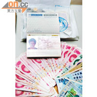 台灣執法人員在被捕二人身上檢獲假護照及大筆人民幣現金。