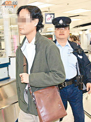 涉案政府統計處統計師被警員拘捕。（馮戈攝）