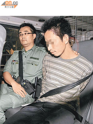 懷疑企圖斬香樹蛇匪被警方拘捕。（胡德威攝）