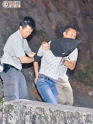 涉嫌企圖爆竊的內地漢被警員拘捕。（李國健攝）