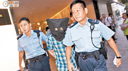 涉案台灣男子被警員拘捕。（李國健攝）