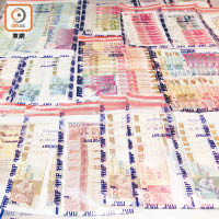 警方在行動中檢獲多種貨幣，折合計約十萬港元。