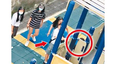 香港仔：女生（箭嘴示）掌摑受襲者（紅圈示），旁邊的少女未加阻止。（Fb石排灣街坊吹水會）