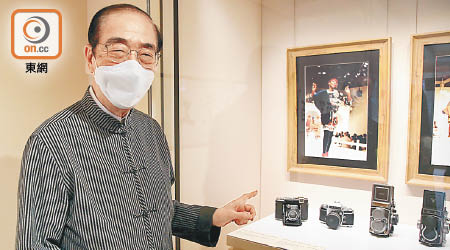 楊孫西用第一份糧買咗部五百蚊嘅菲林相機。