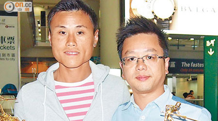 馮國威（右）與李俊威為香港男子桌球隊贏得久違了的世界賽錦標。