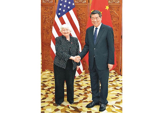 耶倫（左）與何立峰（右）在廣州市舉行會談。（Getty Images圖片）