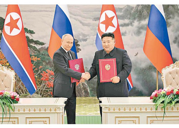 普京（左）與金正恩（右）日前簽署《全面戰略夥伴關係協議》。