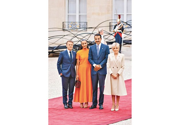 塔米（右二）帶同家屬觀看奧運。左一為法國總統馬克龍。（Getty Images圖片）