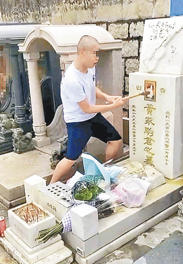 網上流傳一名男子涉嫌破壞黃家駒墓碑的片段。