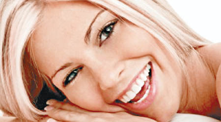 專家指女性笑容最吸引男性。（資料圖片）