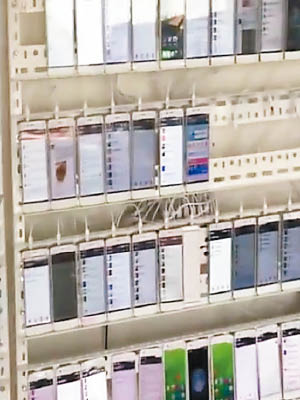 短片拍攝到數百部智能手機組成一幅「電話牆」。（互聯網圖片）