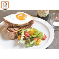 Croque Madame $95<br>麵包夾住2種香料醃製至入味才烹調的豬腩肉，配以煙熏芝士和番茄，面層放有一隻日本太陽蛋，甘香美味。