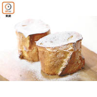 烤焗好的法式樹頭麵包灑上糖粉後，入口香甜鬆軟。