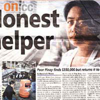 讀者以居港菲律賓人為主的《HONG KONG NEWS》，六月一日頭版報道Mildred拾金不昧的善行。左下角圖片是Mildred向該報記者指示「執金」地點。