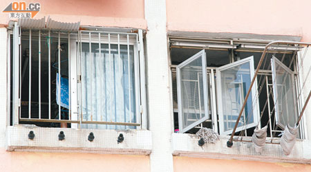 石硤尾邨不少住戶已於露台加設窗戶抵擋風雨。