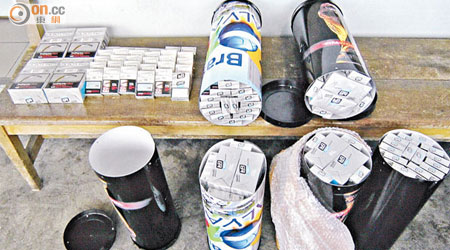 海關上月首次在陸路口岸偵破不法分子利用印有「FIFA & Brazil 2014」字樣膠樽收藏私煙的案件。