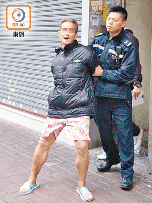 被捕男子不停掙扎喊冤。（張開裕攝）