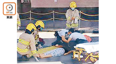 傷者受傷倒地，救護員到場拯救。